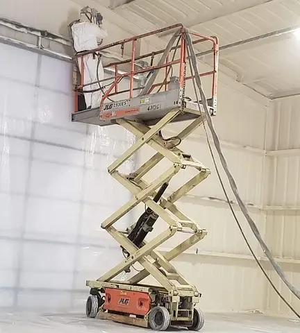 Spray foam application inside a tall commercial building