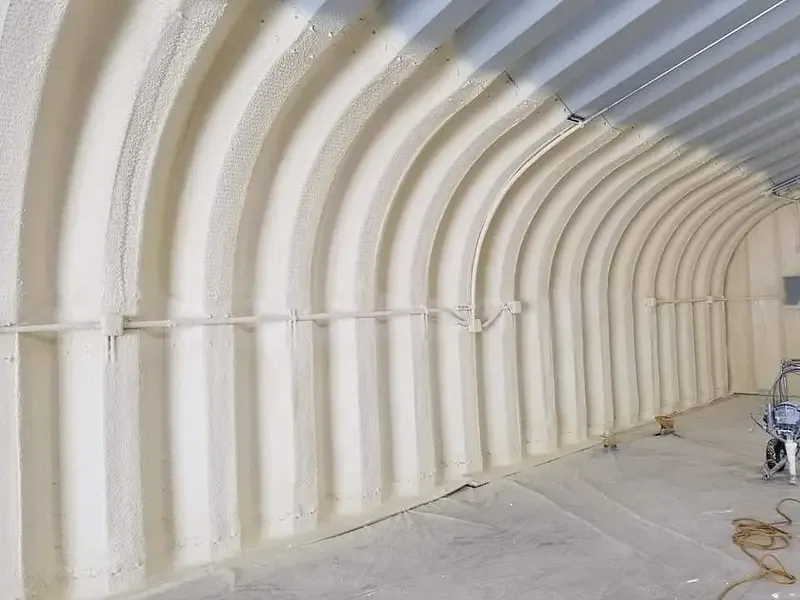 Spray foam insulated interior of an arched metal building