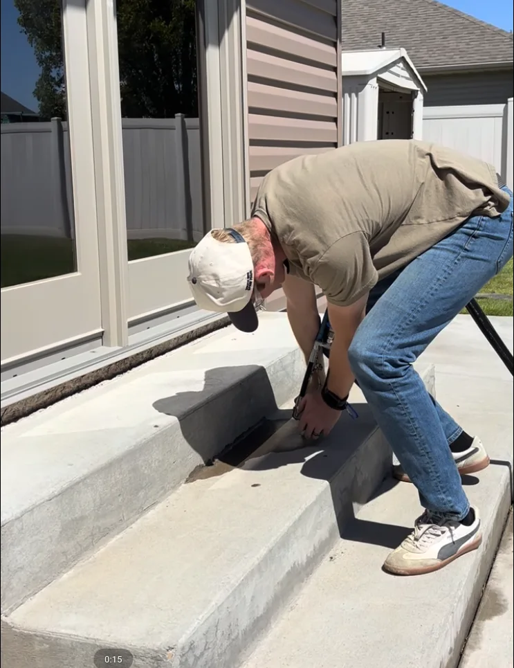 Concrete lifting work at an entry step